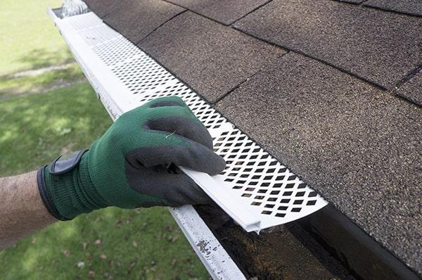 gutter guards work by allowing water to flow through while blocking leaves, debris, and other objects from entering the gutter system